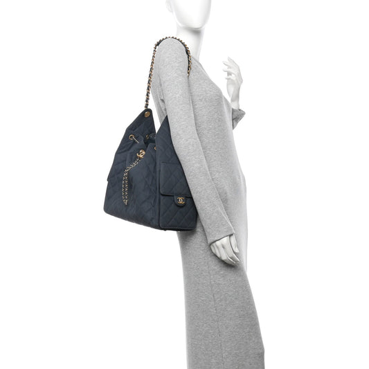Canvas Quilted Medium Chanel 25 Handbag Dark Blue